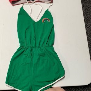 Green romper with rainbow.